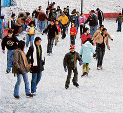 Children enjoy skating at Shimlas ice skating rink on Friday.