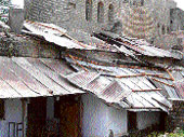 A view of the school that awaits a tin roof.