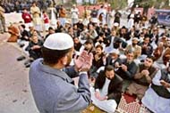 Pakistani lawyers and activists of the Jamaat-e-Islami offer Id prayers outside the residence of deposed judge Iftikhar Muhammad Chaudhry after the police stopped a march in Islamabad on Friday.