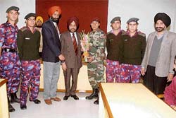 Capt Amarjit Singh (centre), being felicitated by the faculty and NCC cadets at SGGS College-26 in Chandigarh on Saturday.