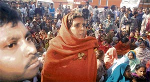 Irate residents of Colony No. 4 stage a protest outside the police station in Industrial Area, Chandigarh, on Sunday.