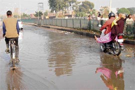 A puddle formed on a road after a water pipe leaked near Nehru Colony in Sector 56, Chandigarh, on Sunday.