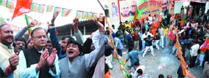 TRIUMPH FOR MODITVA: BJP activists celebrate at the party headoffice in the Capital on Sunday.
