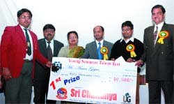 Prof H.P. Dikshit, director general, Good Governance gives away the Fourth Young Scientists Talent Test award to Aman Gupta in the Capital on Sunday. 