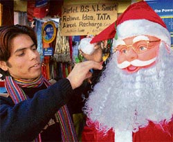 A shopkeeper gears up for Christmas at one of the shops on The Mall in Shimla.
