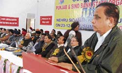 N.K. Gaur, general secretary, All India Bank Employees Association addresses the 8th triennial conference of Pun jab and Sind Bank Staff Organisation in Ludhiana on Sunday.