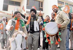 Workers celebrate BJP victory in Gujarat at the state party office in Sector 37, Chandigarh, on Sunday.