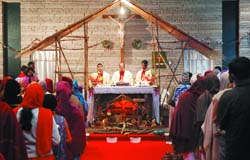 Merry Christmas: Worshippers at the midnight mass on Christmas eve at the Holy Rosary Church in Bathinda.