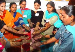 Participants at the NSS camp showing henna designs after a mehandi competition held at SSD Girls College in Bathinda on Monday.
