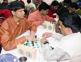 Visually challenged students play chess during a state-level competition at Aggarwal Dharamshala in Ambala on Monday.