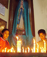 Residents light candles in a city church on Christmas eve in Jalandhar.