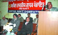 Members of the Akhil Bharatiya Grahak Panchayat speaking on Consumer Day in Bathinda on Tuesday. 