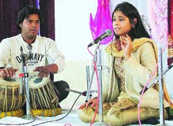 A girl delivers a vocal performance on the first day of the festival.