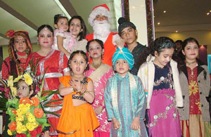 Children pose with Santa at a city bowling alley in Jalandhar on Tuesday.