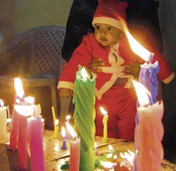 A child dressed as Santa Claus at a church in Amritsar on Tuesday.