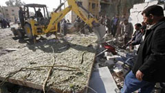 Rescue workers clear the rubble after a suicide truck bomb attack in Baiji, Iraq, on Tuesday.
