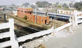 RISKY AFFAIR: The damaged barricade of Jagraon bridge poses a risk to the life of many commuters who cross the bridge in Ludhiana.