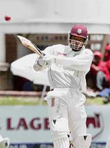 Chris Gayle hits a four on the first day of the Test match between South Africa and West Indies in Port Elizabeth on Wednesday.
