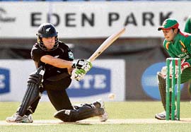 Jamie How (L) plays a shot while Mushfiqur Rahim looks on during the first ODI between New Zealand and Bangladesh at Eden Park in Auckland on Wednesday. 