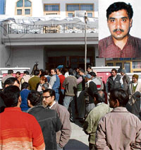 A crowd gathers outside the residence of the victim, Dr Ashwani Choudhary (inset), in Karnal on Thursday.