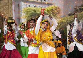 Artistes perform a Haryanavi group dance in Dabra village in Hisar district as part of New Year celebrations. 