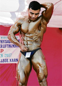 Ram Niwas of Khalsa College, who won the bodybuilding competition in the 82 kg category during the KU inter-college best physique championship at Khalsa College in Karnal on Thursday.