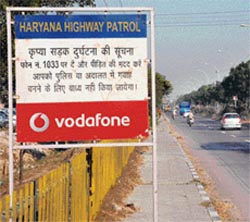 A highway signboard displays a telephone number on which people can inform the authorities about an accident.