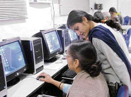 A senior citizen learns computer skills at the DAV College for Girls in Yamunanagar.