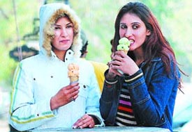 Girls relish ice-cream on a winter day at Model Town in Jalandhar.