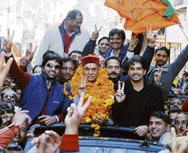 BJP chief ministerial candidate Prem Kumar Dhumal takes out a victory procession in Hamirpur on Friday.