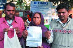 Relatives of Nithari victims during a prayer meet on the occasion of its first anniversary at Jantar Mantar in the Capital on Saturday. 