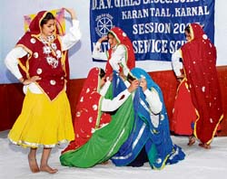 Students of DAV Girls Senior Secondary School perform Haryanavi dance on the last day of an NSS camp in Karnal on Saturday. 