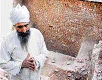 A devotee prays at the site of a 500-year-old room unearthed near Gurdwara Lakhnor Sahib in Ambala on Saturday.