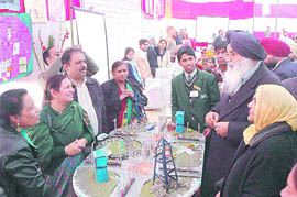 Punjab Chief Minister Parkash Singh Badal interacts with students and teachers