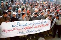 Residents of Narbal and adjoining areas block traffic on the Srinagar-Gulmarg road on Saturday. 