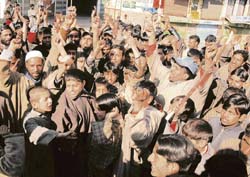 Residents of Chadura tehsil in Budgam district stage a protest, demanding the opening of a degree college in their area, on Saturday. 