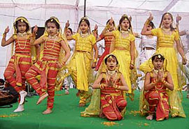 Children perform during the occasion on Sunday. 