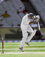 Wasim Jaffer ducks under a bouncer from Brett Lee during the fourth day of the Melbourne Test on Saturday.