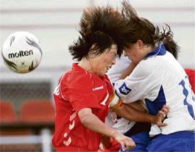 HEAD-ON COLLISION: The ball was supposed to be their target, <p>but it somehow eluded both players during a FIFA Womens World Cup soccer match in China