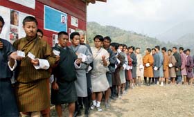 Bhutanese voters wait to cast their votes in Phuentisiling constituency