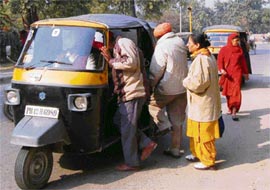 People, who had been waiting for buses, finally get on auto rickshaws to reach Chandigarh from Mohali on Tuesday.