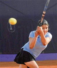 A player of Chandigarh Club Tennis Academy returns a backhand during a tennis tournament at St. Peter School, Sector-37, Chandigarh on Tuesday.
