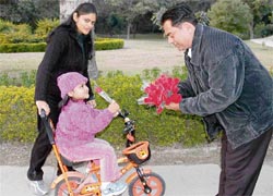 The new manager of the Sector 36 Fragrance Garden welcomes visitors to the park with roses on the first day of New Year in Chandigarh.