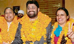 Newly elected mayor Pradeep Chhabra acknowledges the greetings of his admirers after his election in Chandigarh on Tuesday.