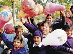 Slum children enjoy at Sukhna Lake during the Chandigarh New Year festival on Tuesday.
