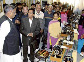 Education minister Mange Ram Gupta (extreme left) at the inauguration of a women fashion designing centre in Karnal on Tuesday.