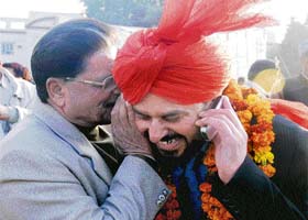Did you expect it? Senior minister Gulchain Singh Charak has something to tell newly inducted minister Gharu Ram soon after his swearing-in in Jammu