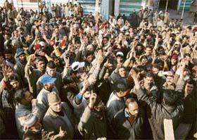 Residents shout slogans against the state government demanding a college in Chadoora in Budgam district, 16 km from Srinagar