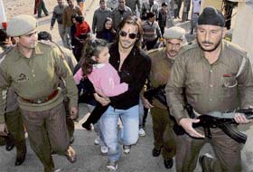 Bollywood actor Vivek Oberoi, surrounded by security guards, going to pay obeisance at the Kali Mata Temple at Bahu Fort in Jammu
