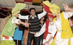 Harbhajan Maan shakes his legs on Punjabi numbers with students of GNKCW in Ludhiana to celebrate New Year on Tuesday.